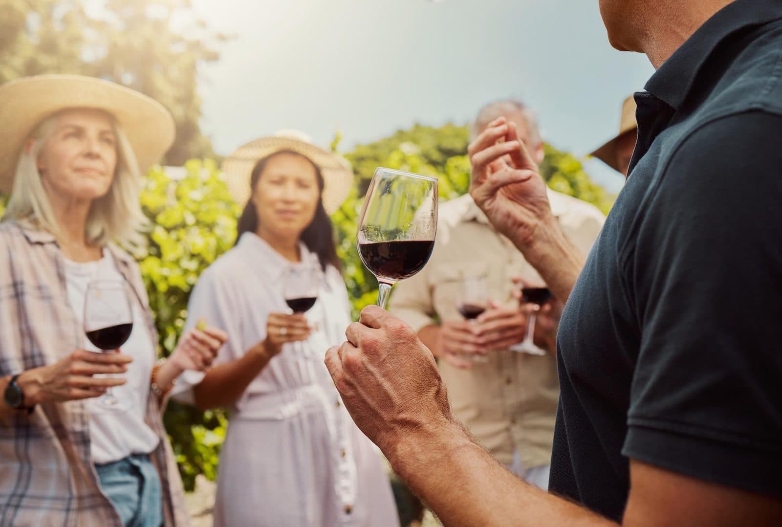 Guests tasting red wine outdoors. Avanos Wine Tasting, arranged from The Owl Cave Hotel in Göreme, Cappadocia.