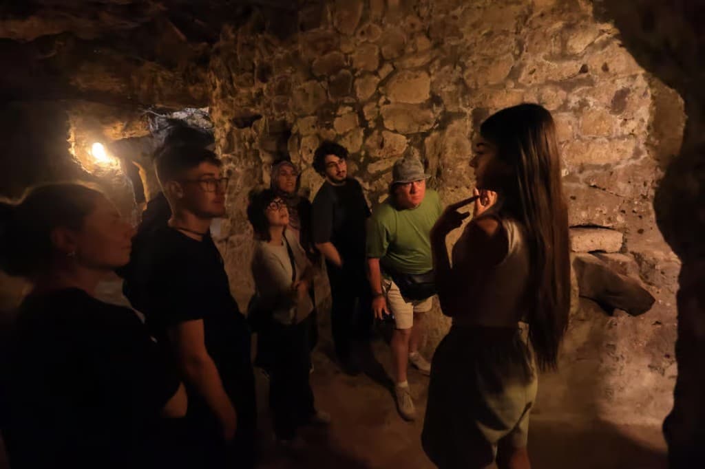 Guide explaining Derinkuyu Underground City on the Cappadocia Green Tour from The Owl Cave Hotel, Göreme, Cappadocia