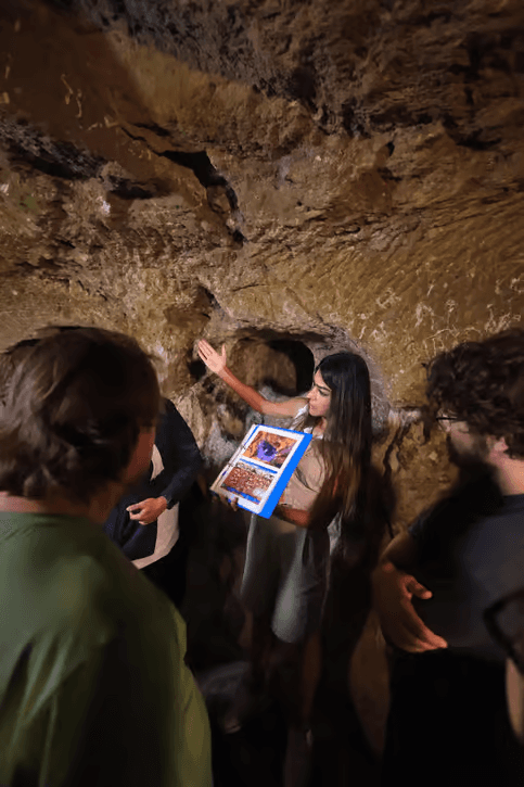 Guide showing cave-church frescoes in Ihlara Valley on the Cappadocia Green Tour from The Owl Cave Hotel, Göreme
