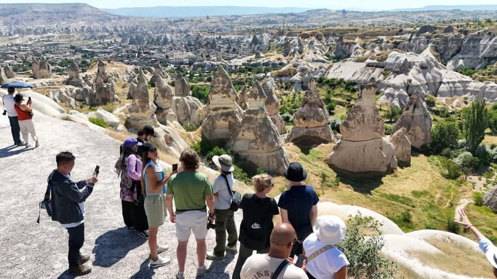 Guests overlooking Pigeon Valley fairy chimneys on the Cappadocia Green Tour from The Owl Cave Hotel in Göreme