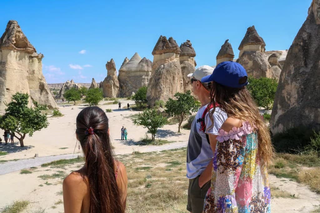 Guests overlooking Paşabağ fairy chimneys on the bookable Cappadocia Red Tour from The Owl Cave Hotel, Göreme