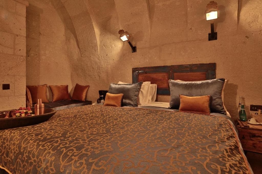 Stone seating niche in the bookable Deluxe Arch Room with View at The Owl Cave Hotel, Göreme, Cappadocia
