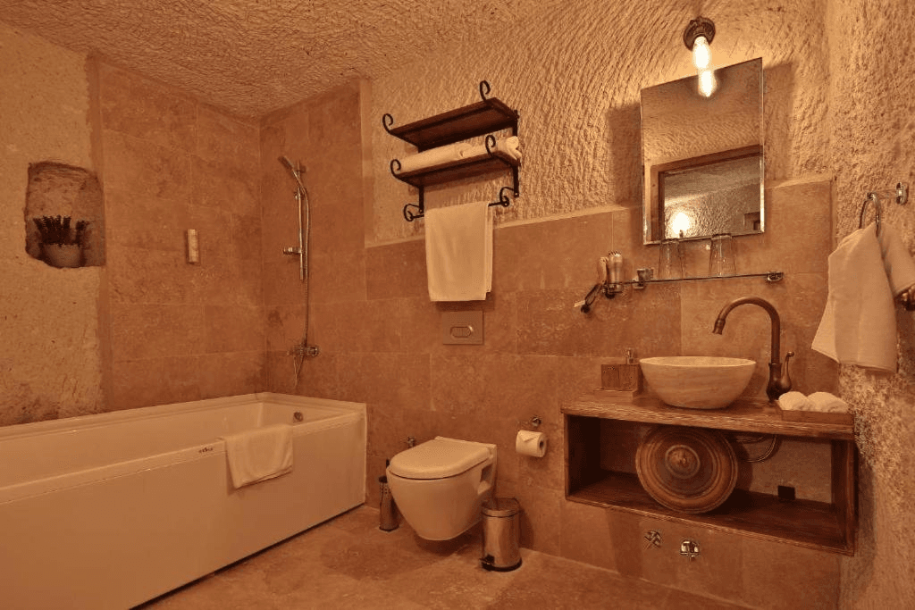 Private bathroom with bath and shower in the bookable Family Suite at The Owl Cave Hotel, Göreme, Cappadocia