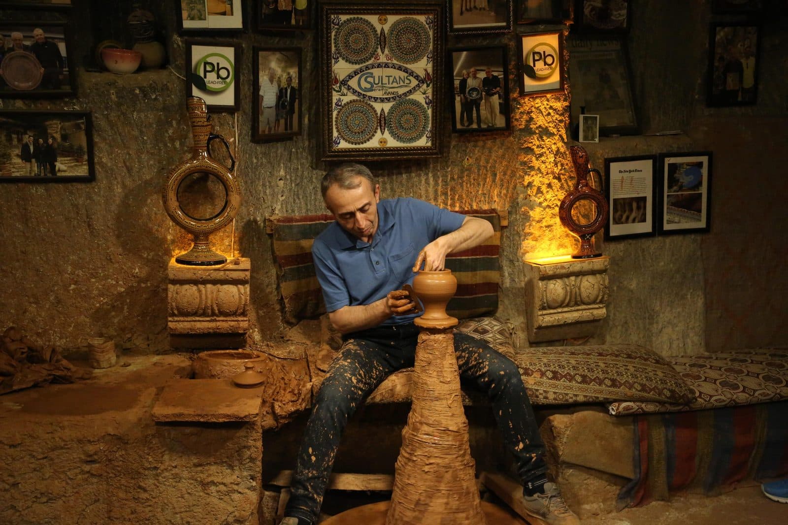 A potter at a kick wheel inside a cave workshop. Avanos Pottery Workshop, arranged from The Owl Cave Hotel in Göreme, Cappadocia.