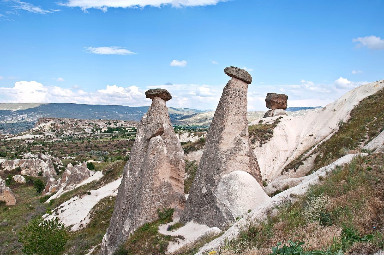 Tall fairy chimneys above a valley. Sunrise Balloon and Cappadocia Day, arranged from The Owl Cave Hotel in Göreme, Cappadocia.
