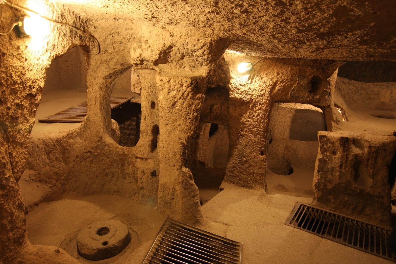 A round stone door inside an underground chamber. Green Tour with Narlıgöl, arranged from The Owl Cave Hotel in Göreme, Cappadocia.