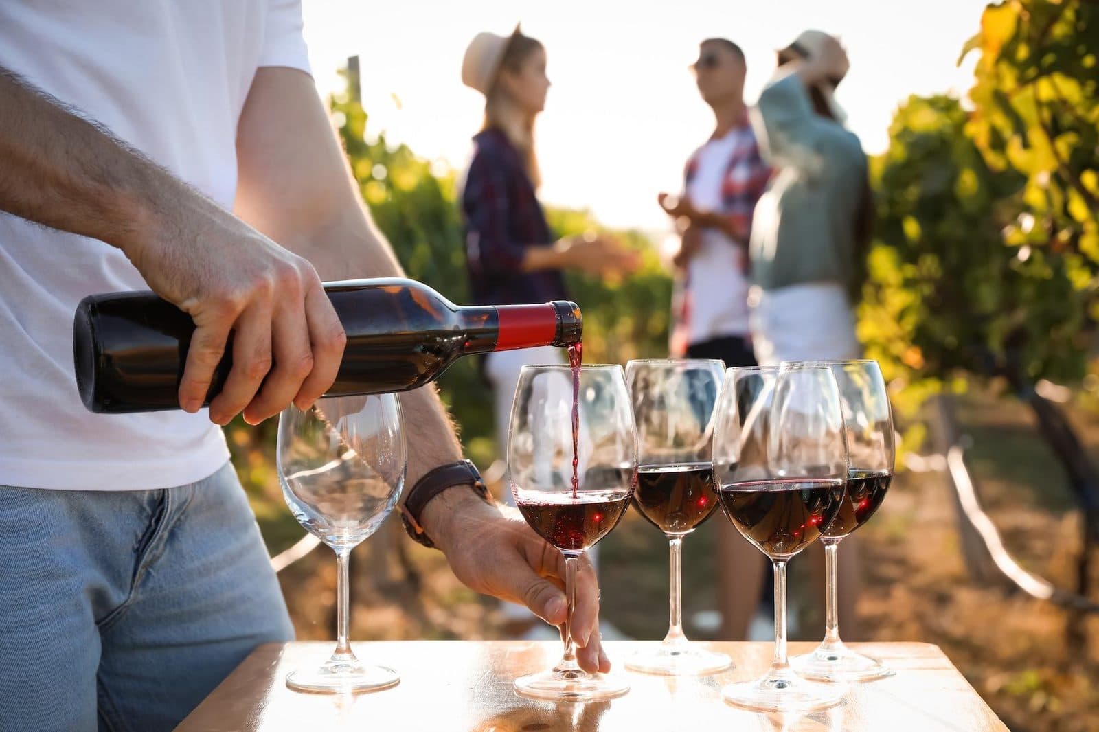 Red wine being poured outdoors. Fairy Chimneys and Wine Tasting, arranged from The Owl Cave Hotel in Göreme, Cappadocia.