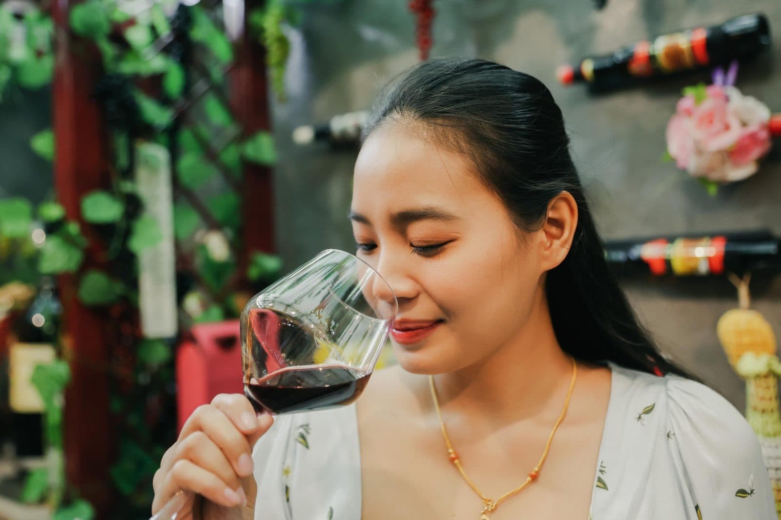A guest smelling a glass of red wine. Fairy Chimneys and Wine Tasting, arranged from The Owl Cave Hotel in Göreme, Cappadocia.
