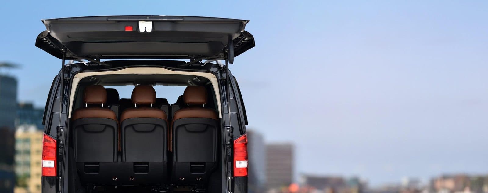 The open trunk of a van, leather seats inside. Nevşehir Airport Transfer, arranged from The Owl Cave Hotel in Göreme, Cappadocia.