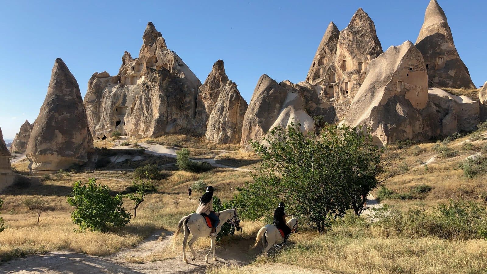 A rider on a ridge of fairy chimneys. Sunrise Horse Ride, arranged from The Owl Cave Hotel in Göreme, Cappadocia.