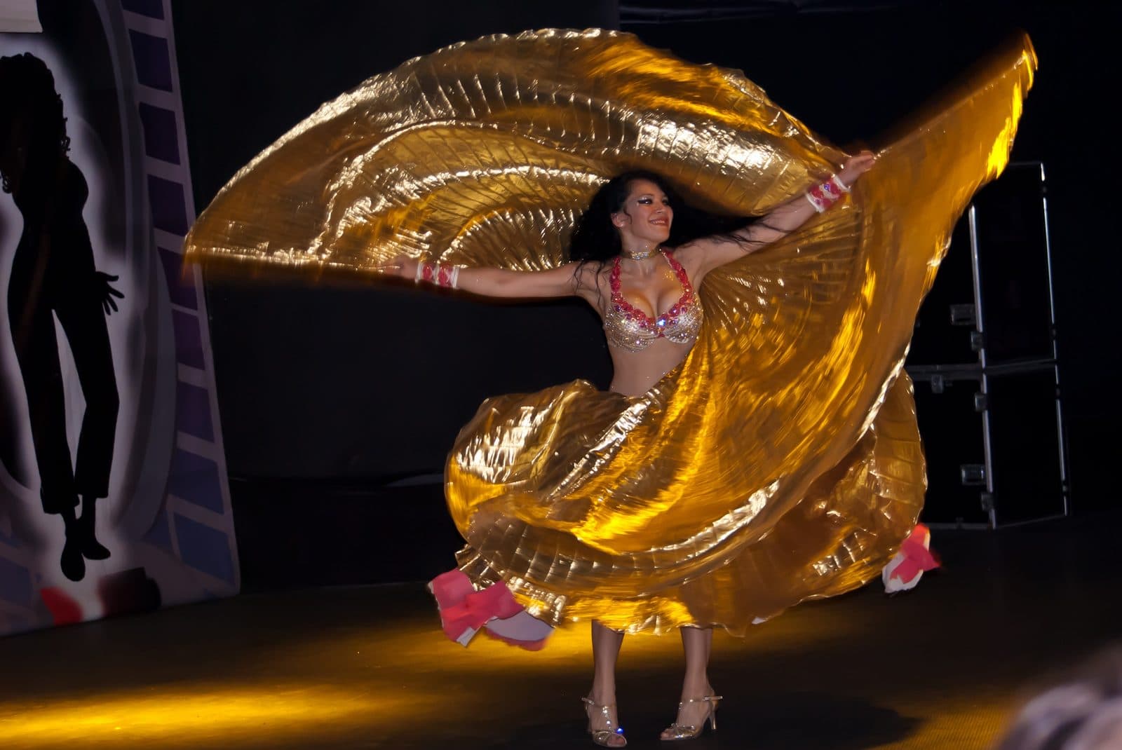 A dancer spinning a gold veil. Turkish Night at a Cave Restaurant, arranged from The Owl Cave Hotel in Göreme, Cappadocia.
